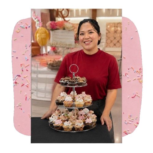 Gurpreet, founder of Bake Bliss, holding a decorated cake